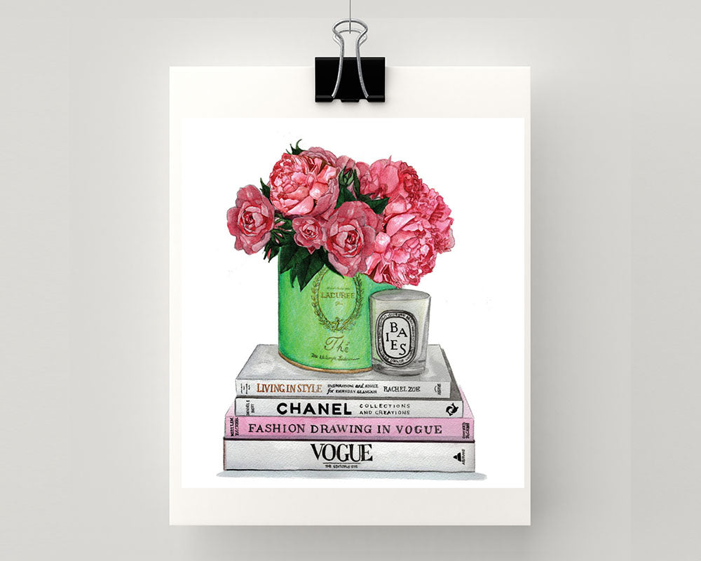 Print of Chanel & Vogue books atop with Laduree vessel holding roses and peonies