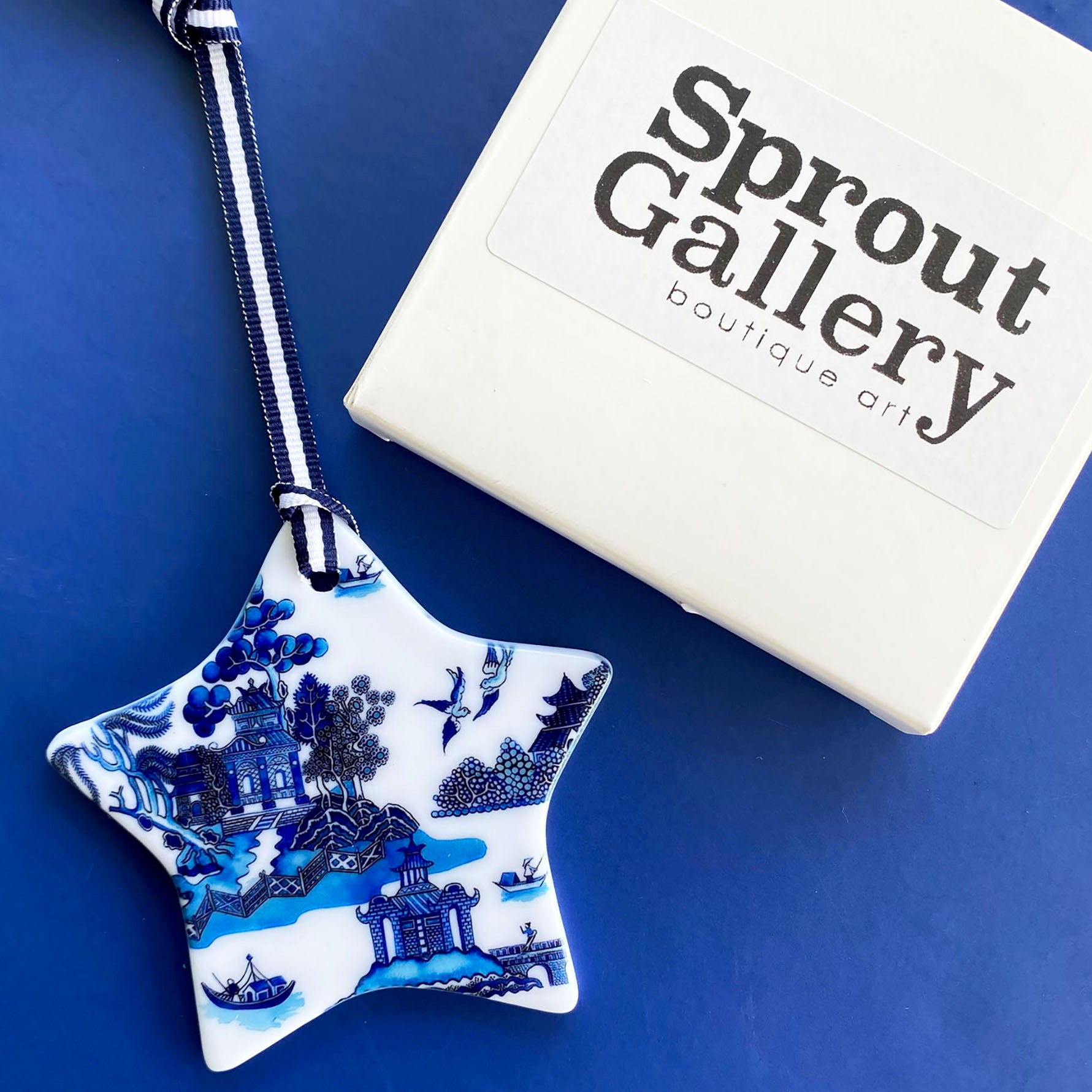 Blue and white ceramic ornament -  Willow star design