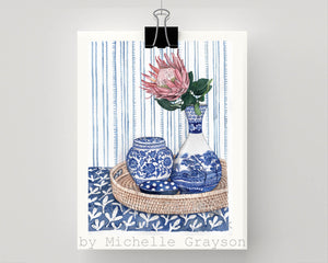 Blue and White vignette with protea on rattan tray