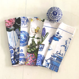 Tea Towel of protea in blue white vase on rattan tray