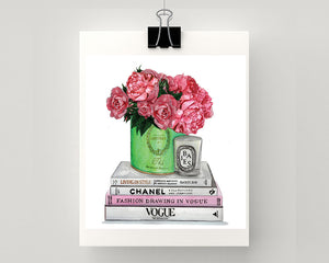 Print of Chanel & Vogue books atop with Laduree vessel holding roses and peonies