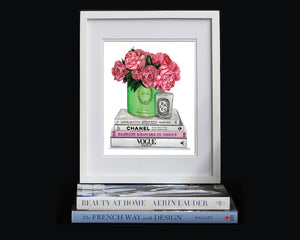 Print of Chanel & Vogue books atop with Laduree vessel holding roses and peonies