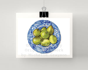 Print of pears on a blue and white plate