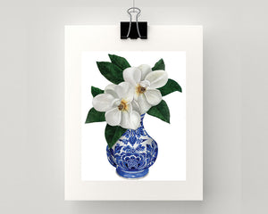 Print of magnolias in a blue and white vase