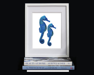 Print of seahorses in blue accents