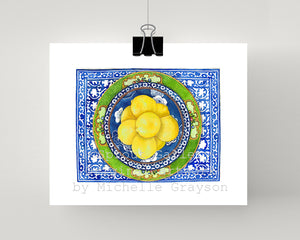 Print of lemons on blue and white plate with antique green plate