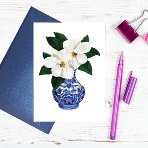 Single orchid in a traditional blue and white vase card