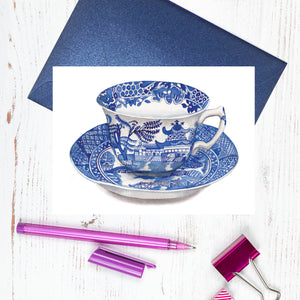 A blue and white Spode Willow design cup and saucer card
